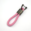 A pink braided cord key case cover with a metal clasp and loop.