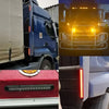 Close-up view of a blue heavy duty truck with various light bars and components.