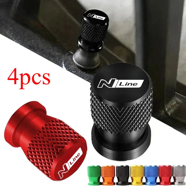 Set of four black and red aluminum tire valve caps for car wheels
