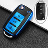 A blue TPU car key fob cover with multiple buttons is shown on a black textured surface, next to an inset showing the key fea
