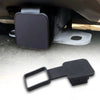 A black universal trailer hitch receiver cover is shown mounted on a vehicle's undercarriage.