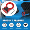 A close-up view of a red racing tow hook sticker being installed on a blue car bumper.
