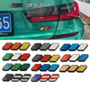 A collection of tri-color 3D car grill decals for various vehicles, including various colored and patterned stickers.