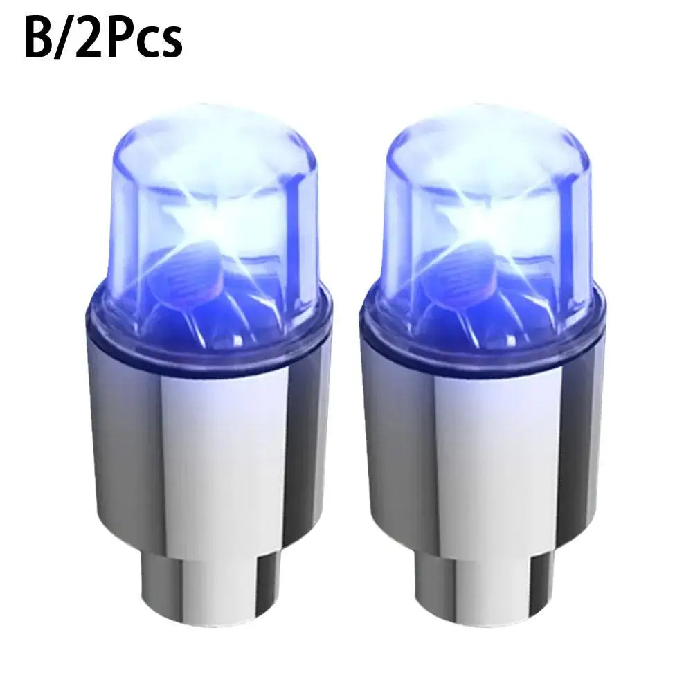 Two universal LED wheel lights for bikes and cars with silver bases