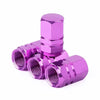 A shiny magenta aluminum alloy tire valve cap with a hexagonal shape.