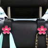 Support de tête de siège de voiture noire avec accents de fleur rose et chaîne dorée