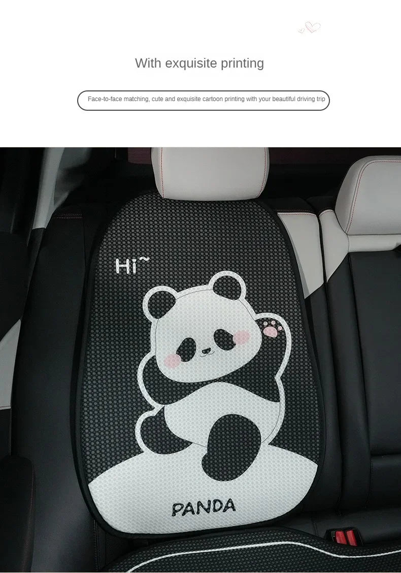 A black and white cartoon panda print on a car seat cushion.