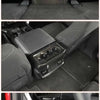 Close-up view of carbon fiber grain interior trim kit installed in a vehicle dashboard.