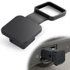 A black universal trailer hitch receiver cover with a handle, shown next to an open hitch receiver.