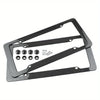 Black carbon fiber license plate frame with mounting hardware for a vehicle