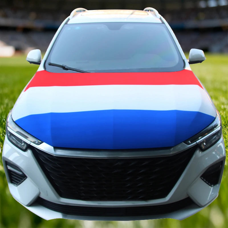 A white car hood decorated with a flag featuring horizontal stripes of red, white, and blue.