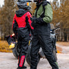Two individuals wearing multi-function raincoat and cycling gear standing outdoors in a wooded area.
