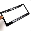 Black AKINA Speed Stars license plate frame decoration being held by a hand