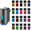 A collection of portable car air fresheners in various colors and scents displayed next to a silver diffuser.