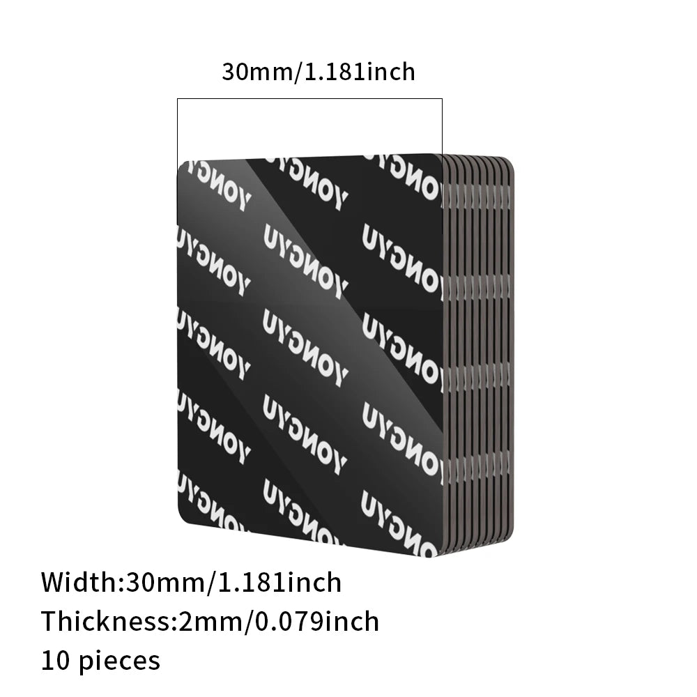 A stack of ten black heavy duty double-sided adhesive pads, each measuring 30mm thick.