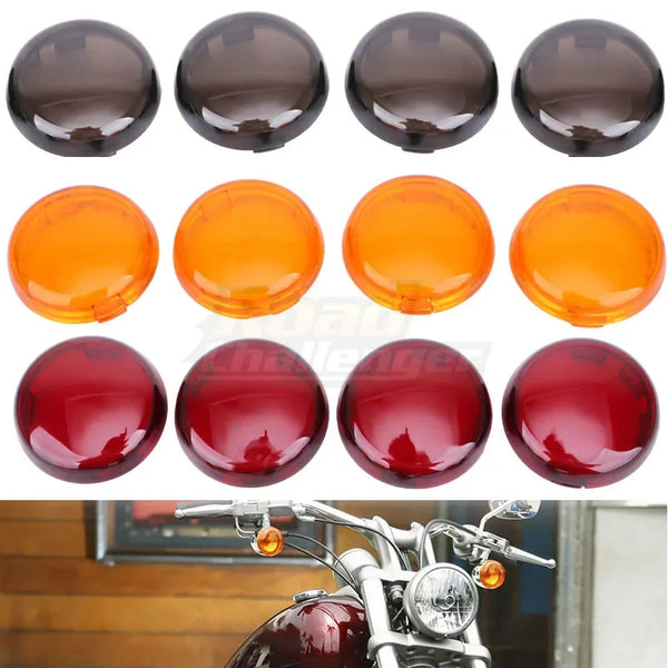 A set of various colored LED turn signal lens covers for Harley motorcycles displayed on a motorcycle.
