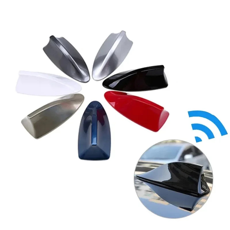A collection of various colored shark fin decorative car antenna covers displayed in a circular arrangement.