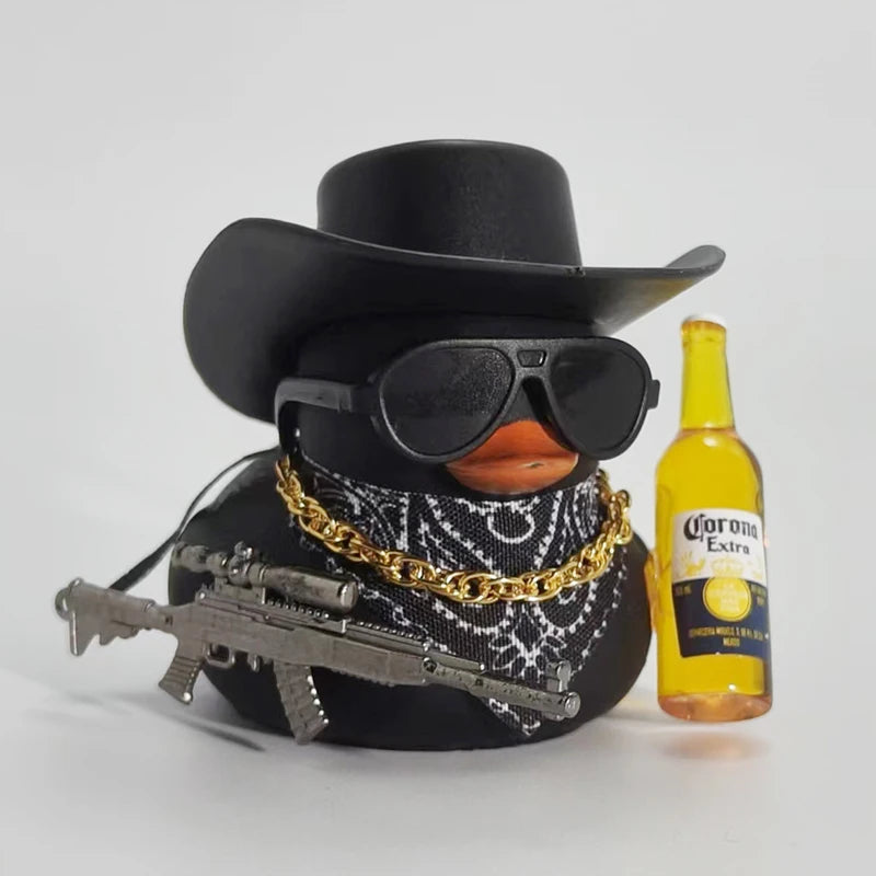 A black rubber duck with a cowboy hat and sunglasses is shown next to a bottle of Corona Extra.