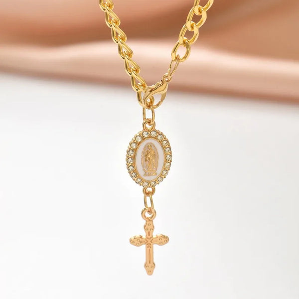 Gold chain rosary necklace featuring a pendant with a religious figure and a cross.