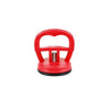 Red car dent remover puller with a suction cup mechanism.