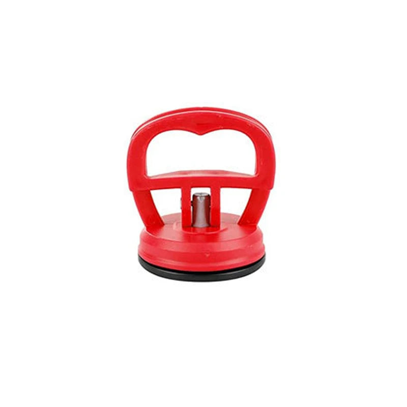 Red car dent remover puller with a suction cup mechanism.