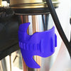 A purple universal motorcycle oil seal cleaning tool is shown being used on a metal component.