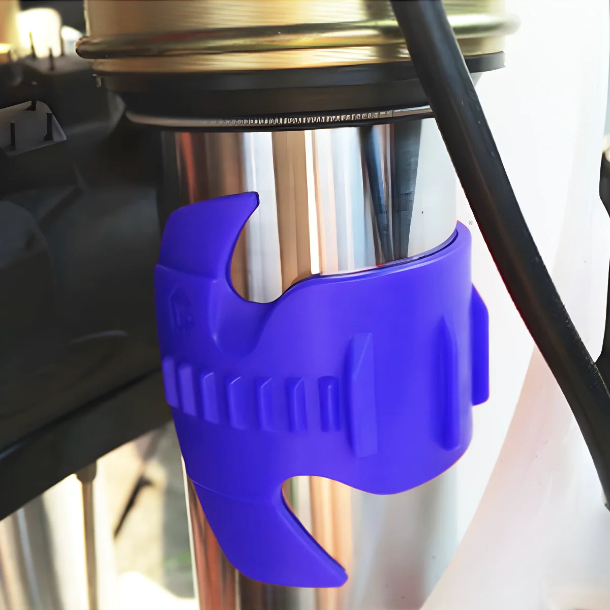 A purple universal motorcycle oil seal cleaning tool is shown being used on a metal component.
