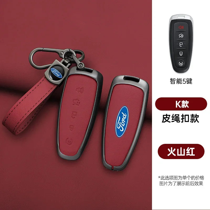 A red leather car key cover and remote fob with a lanyard displayed on a maroon background.