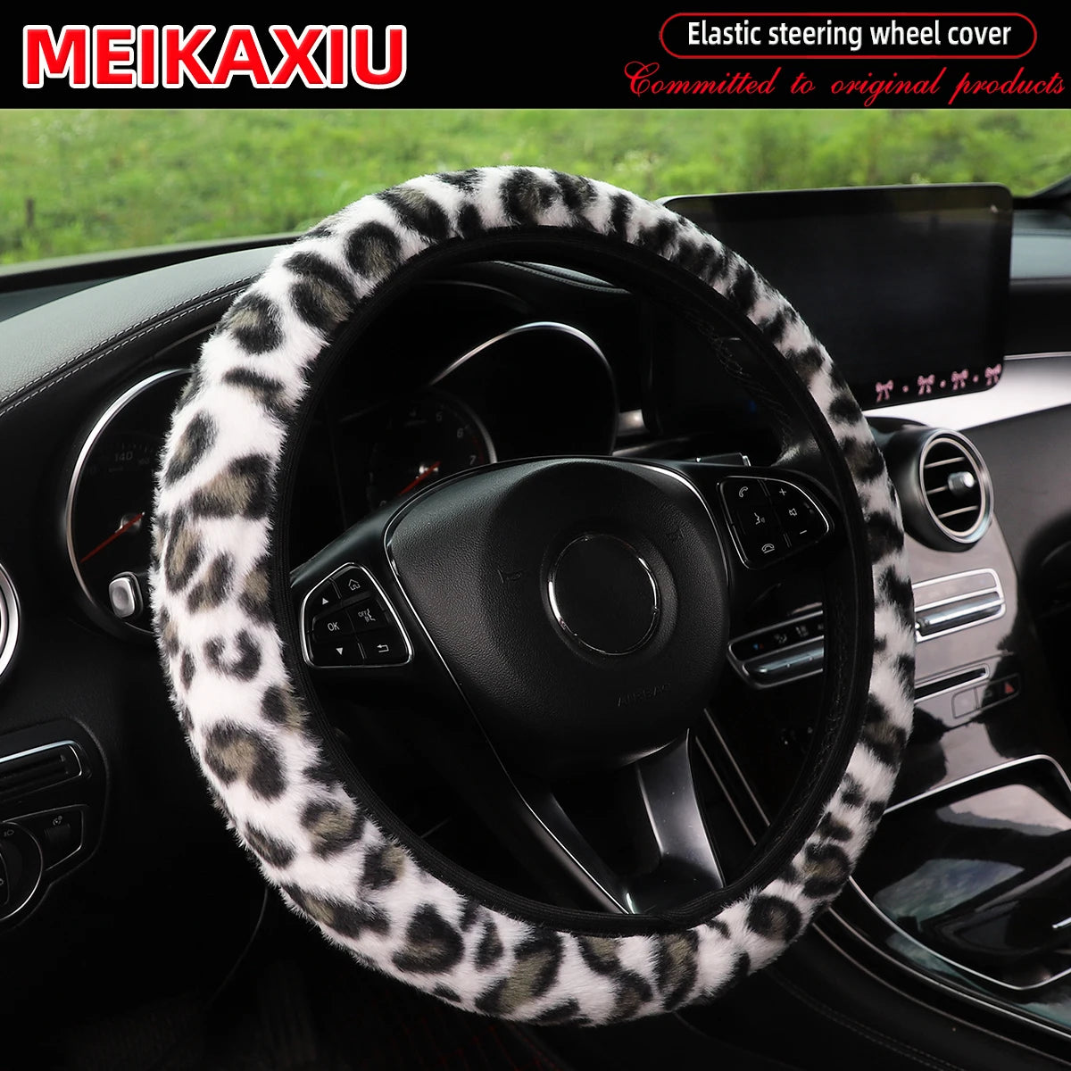 Leopard print plush steering wheel cover installed in a car interior.
