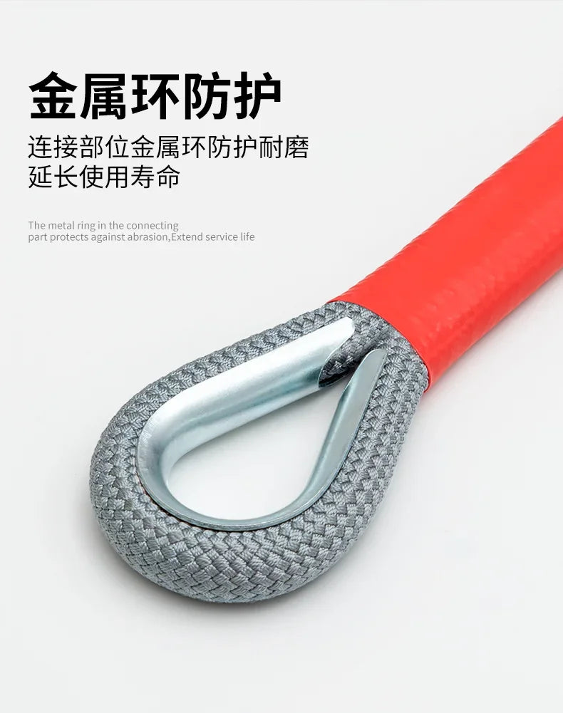 A close-up of a metal towing rope with a textured grip and an orange handle, designed for metal protection.