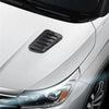 Carbon fiber hood scoop vent trim on a white car's front fender.