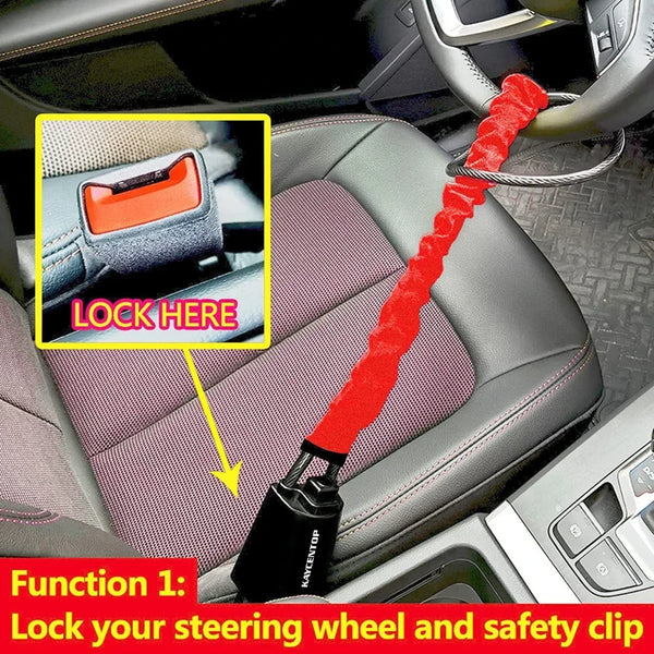 A red locking mechanism is shown securing a steering wheel and seat belt in a car interior.