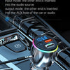 A close-up view of a silver Bluetooth FM transmitter device inserted into a car audio port.