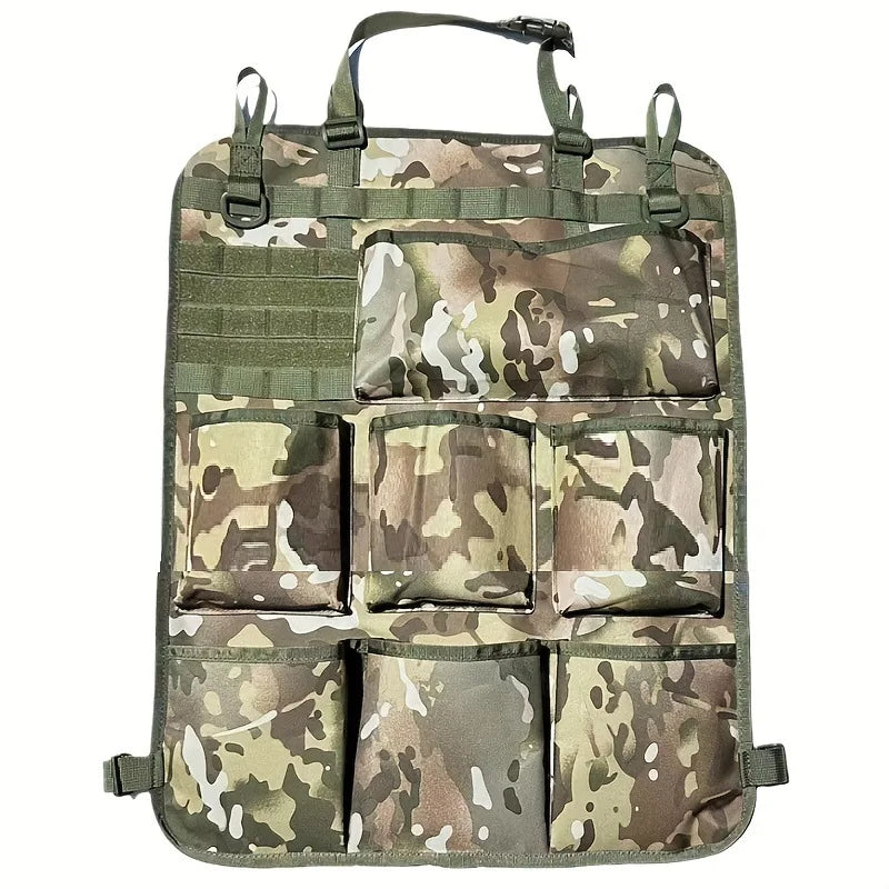 A green and brown camouflage seat back organizer with multiple compartments for storage.