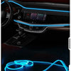 Flexible blue fiber optic LED cable fitting into a car interior dashboard