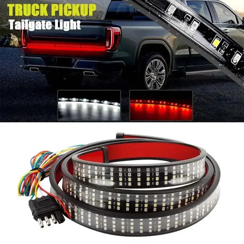 A flexible LED light bar for a truck tailgate, featuring multiple bright white and red lights.