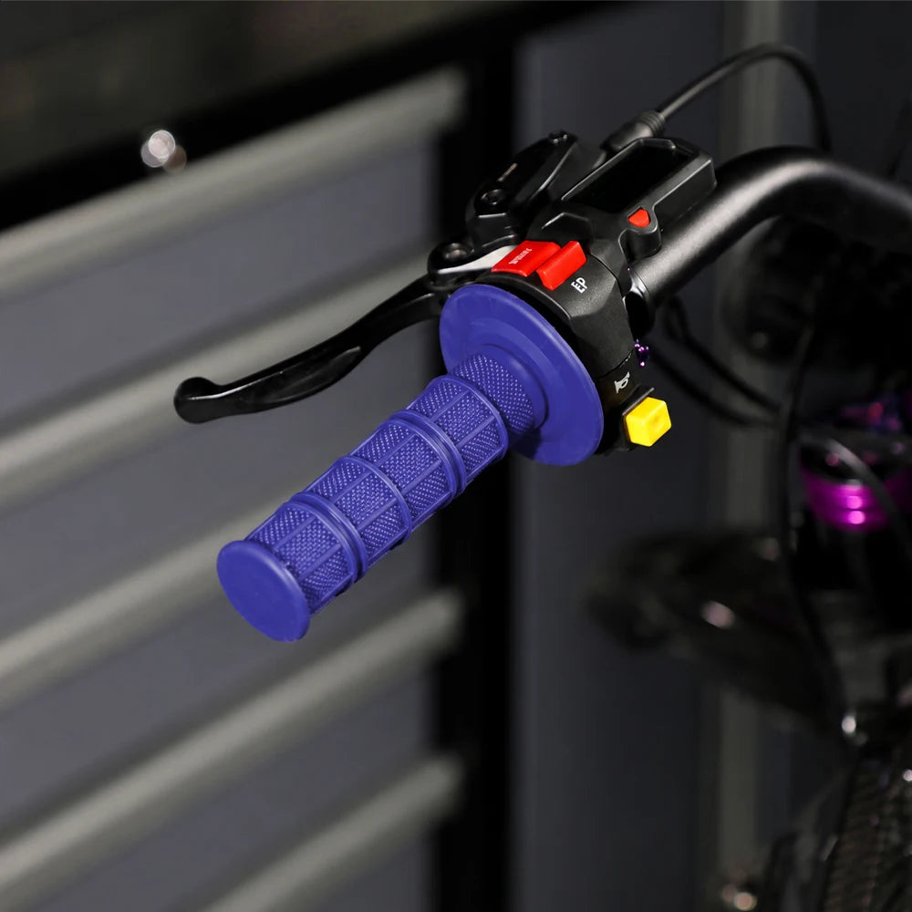 Close-up of black silicone handle bar grips with purple and yellow accents mounted on a motorcycle handlebar.