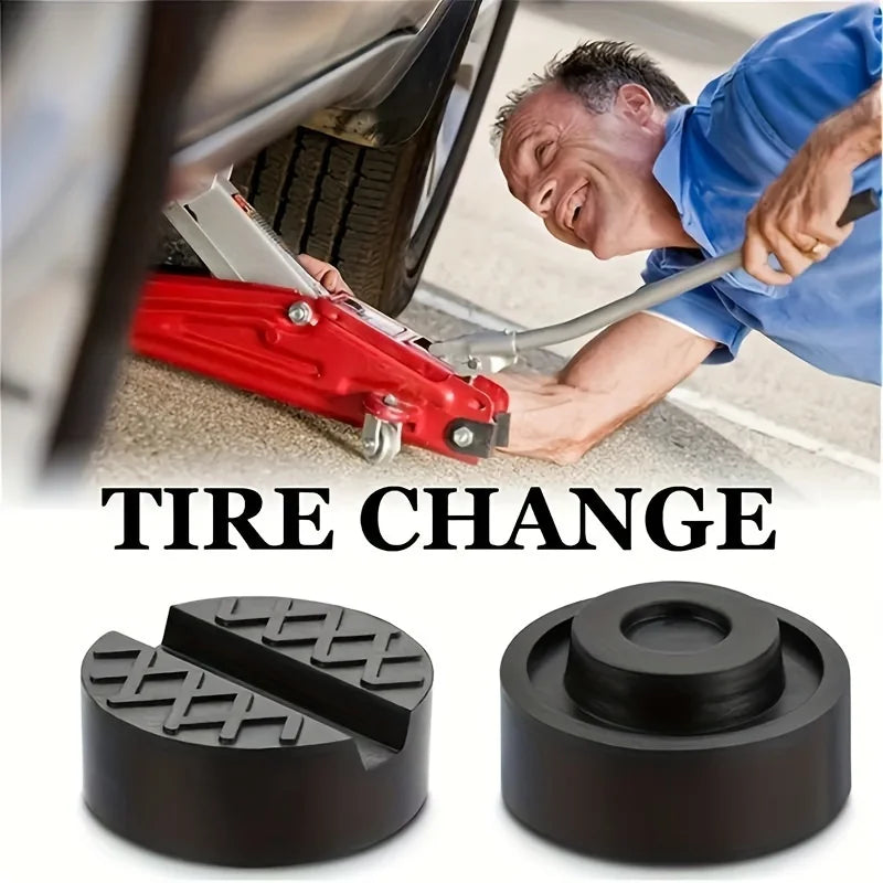 A close-up of a red tire changing tool and rubber jack pad for frame rail protection.
