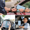 A woman is holding a blue leather card holder wallet for ID and license inside a red car.