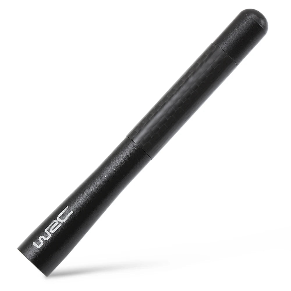 A black carbon fiber radio antenna is shown diagonally against a white background.