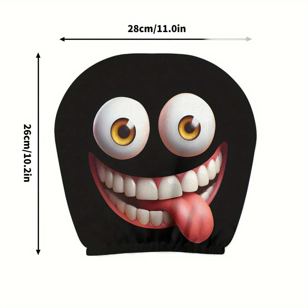 A black cartoon design featuring a wide, smiling mouth and big eyes with a tongue sticking out.