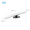 A white, convex angle car mirror with a black base shown from the side.