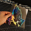 A glossy decal featuring a silhouette of praying hands with crosses and a rainbow gradient effect.