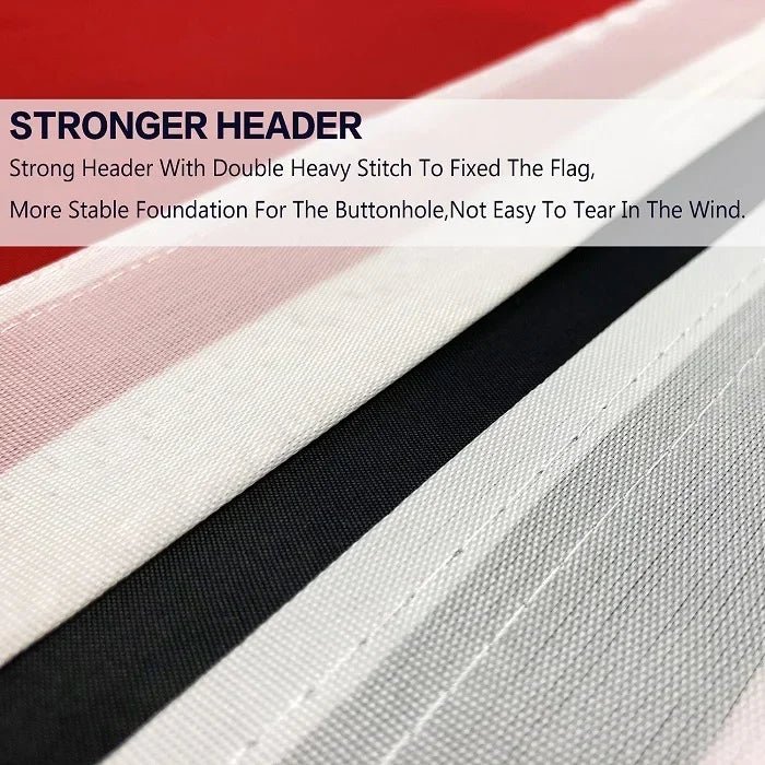 Close-up of a striped fabric flag with a black band and white stripes, showing a strong header detail.