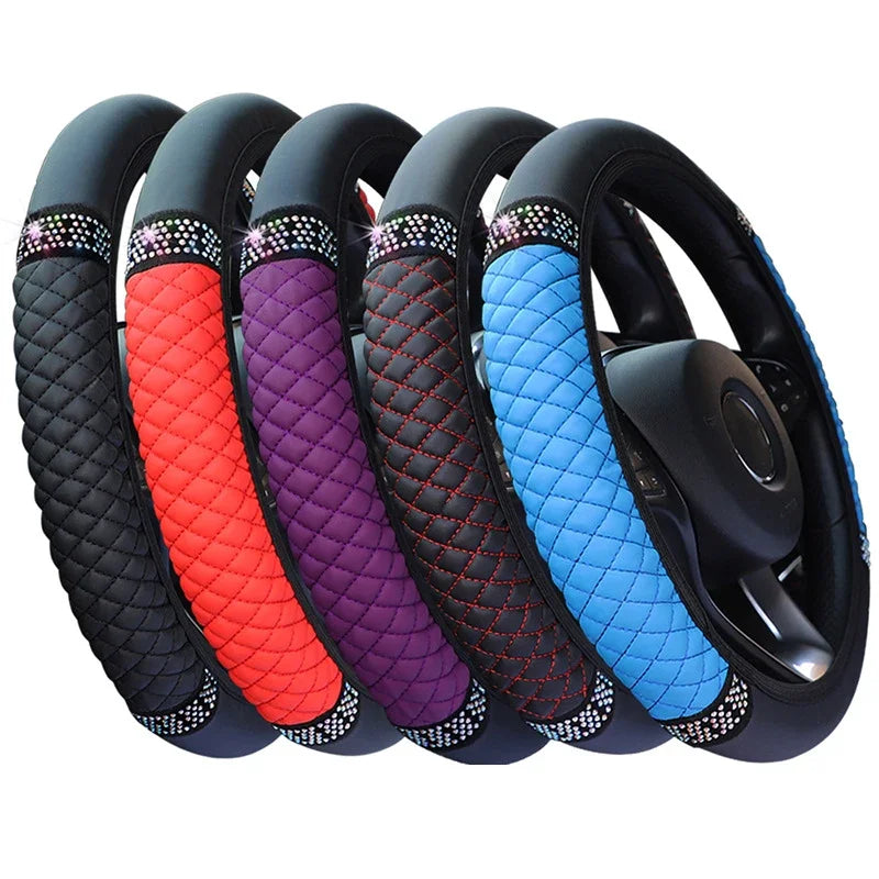 A set of black steering wheel covers featuring vibrant colors like red, purple, and blue with decorative stitching.