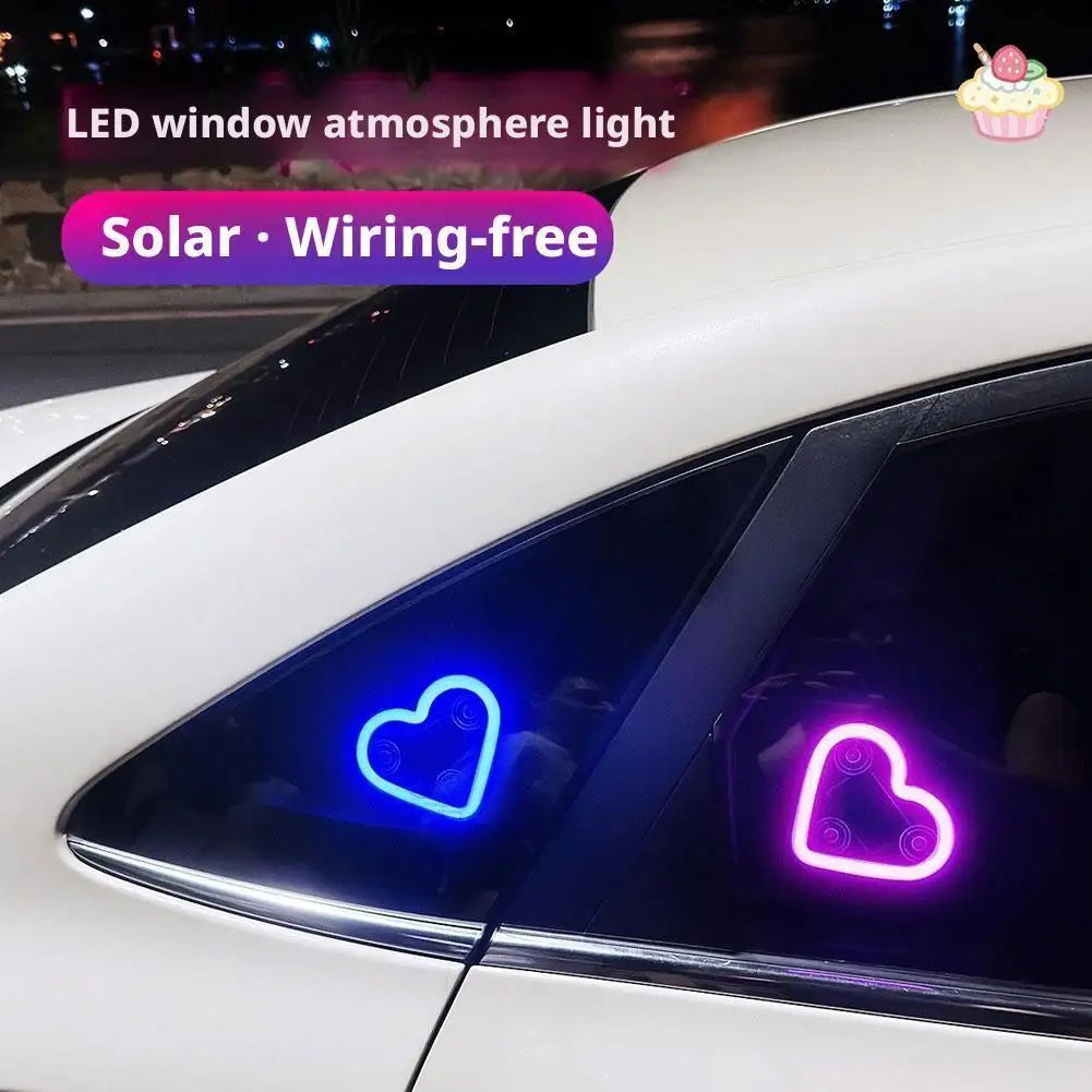 A white car window features a glowing blue heart light, demonstrating a solar wiring-free LED window atmosphere light.