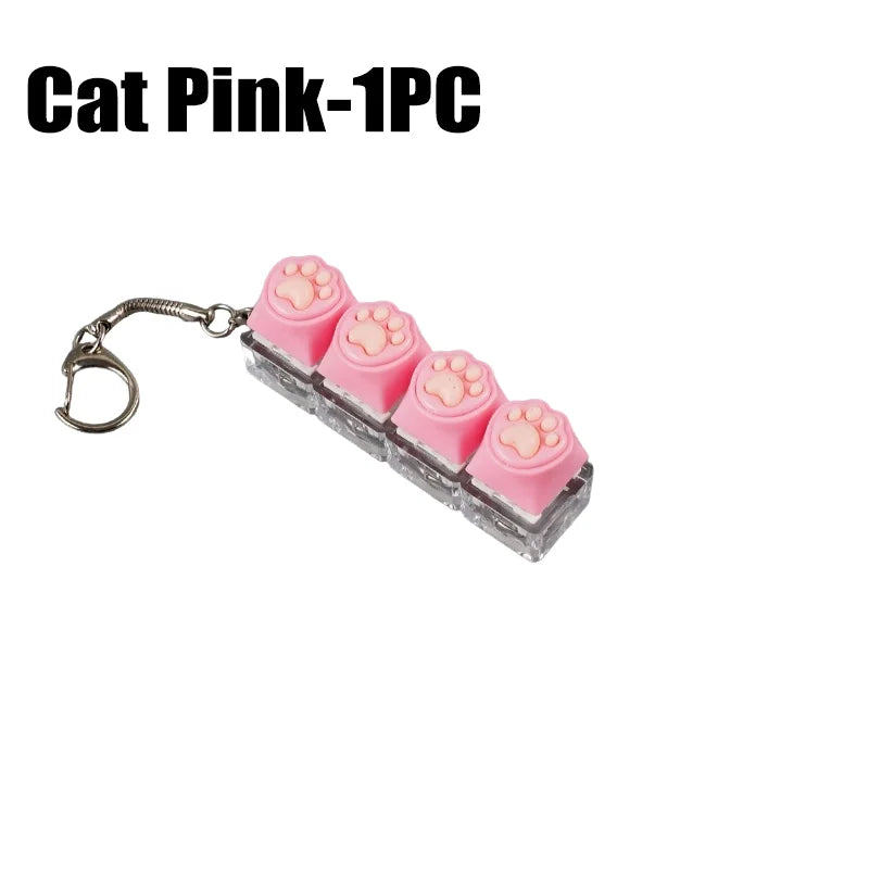 Pink silicone fidget toy shaped like a cat, packaged as a 1 piece keychain.