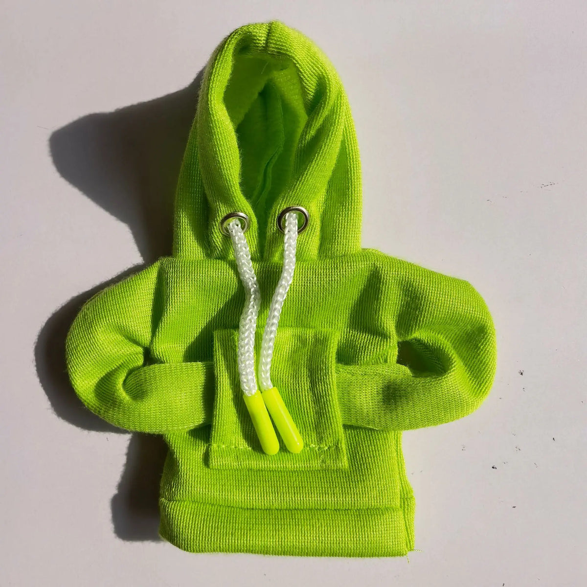 A bright lime green hoodie cover with white drawstrings displayed on a white background.