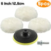 Five white wool polishing pads and a mounting screw for auto detailing