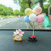 Harz-Blumentopf Elfen-Auto-Dekoration mit kleinem weißem Gesicht und rosa Blume auf schwarzem Sockel